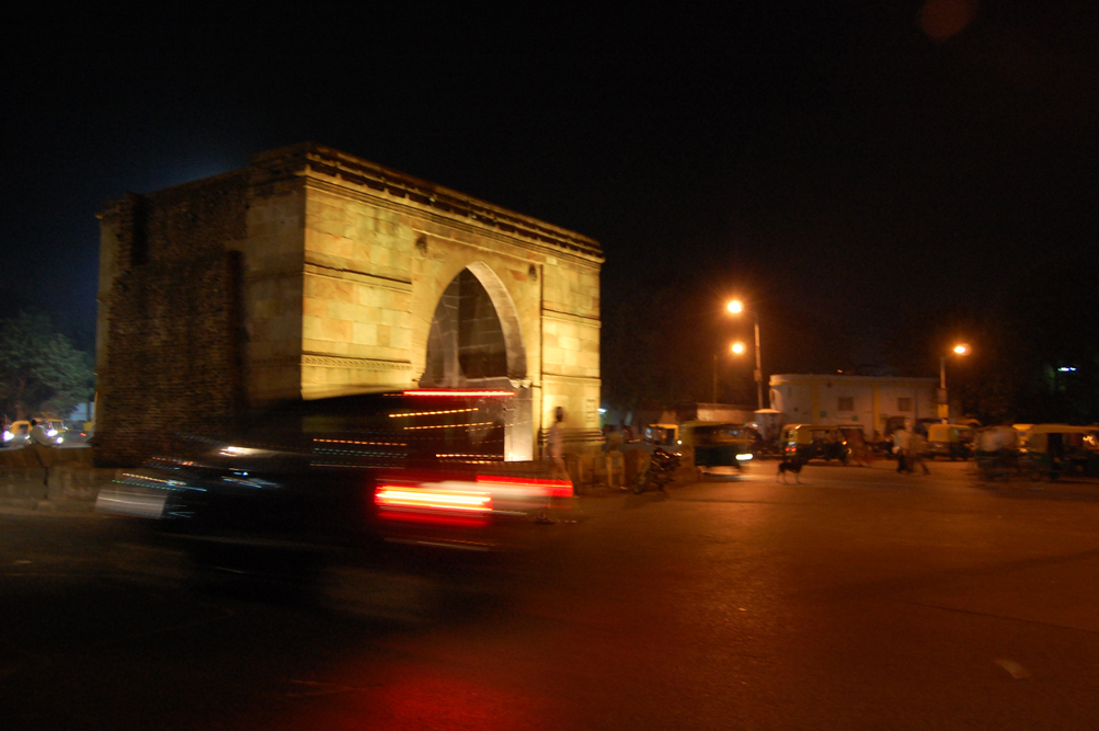 Real photograph of illuminated 15th-century Astodia Darwaja at night